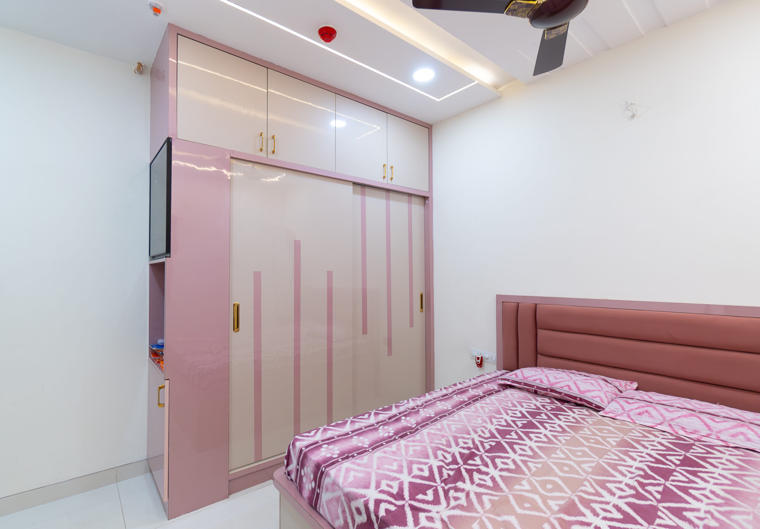Modern smart wardrobe design with organized storage, sliding doors, and elegant finish, crafted by interior designers in Hyderabad for stylish and clutter-free bedrooms.